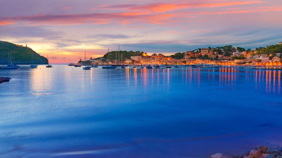a body of water with a city in the background