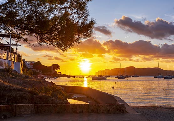 a sunset over a body of water