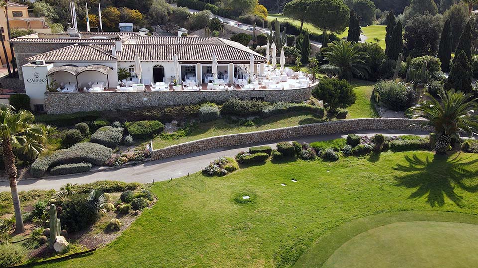 a building with a large lawn