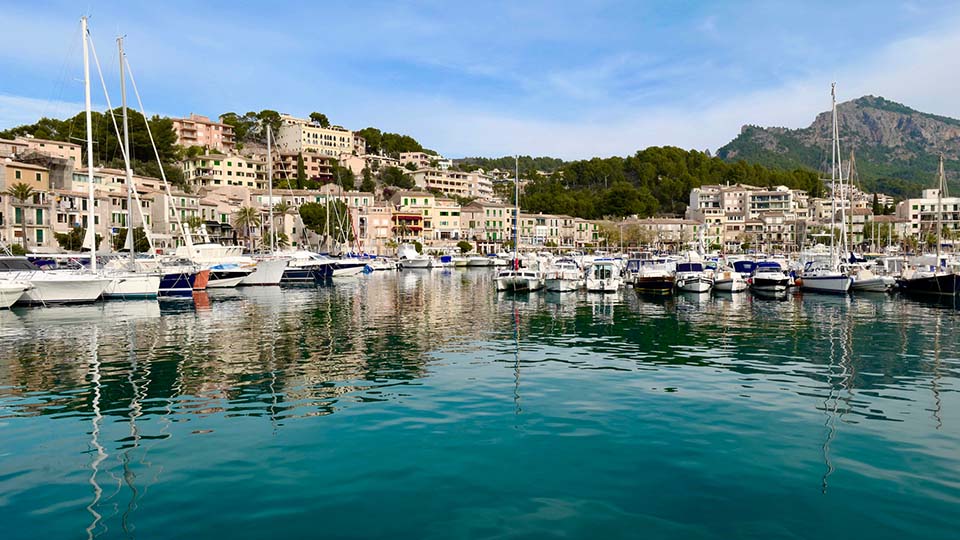 a body of water with boats in it and buildings around it