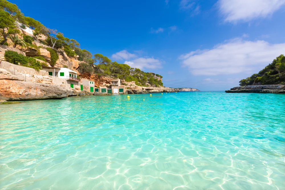 a body of water with houses on the shore